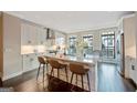 Bright kitchen with stainless steel appliances, an island, and dark hardwood floors at 3028 Pruitt Ln, Smyrna, GA 30080