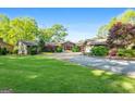 Charming home with manicured lawn, stone accents, and a welcoming entrance, perfect for Gathering living and entertaining at 8655 Shoreline Dr, Jonesboro, GA 30236