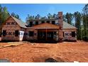 Exterior view of a new home under construction showcasing the framing of the house at 0 Pinegate Way, Sharpsburg, GA 30277