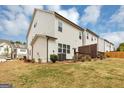Spacious backyard featuring a well-maintained lawn and a small deck, perfect for outdoor relaxation at 1393 Halpern Nw Ln, Kennesaw, GA 30144