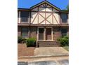 Charming two-story townhome with brick facade, front steps, and well-maintained landscaping at 3244 Abbeywood Dr, Decatur, GA 30034
