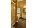 Bathroom featuring a tub, separate shower, and white vanity with a granite countertop at 4194 Wesley Hall Ln, Decatur, GA 30035