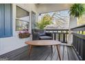 Relaxing covered porch featuring comfortable seating with flower box and nice view at 1766 Ware Ave, East Point, GA 30344