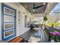 Inviting covered porch featuring stylish seating and a view of the neighborhood at 1766 Ware Ave, East Point, GA 30344