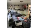 Comfortable living room featuring a large sectional couch, decorated walls, and an open view to the kitchen at 345 S Magnolia Se Walk, Atlanta, GA 30349