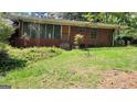 Single story brick home with green space around it at 1198 Lynhurst Sw Dr, Atlanta, GA 30311
