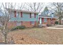 Split-level home with a mix of brick and siding, offering a glimpse of its classic design at 77 Crystal River Dr, Riverdale, GA 30274
