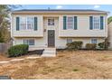 Charming two-story home with green shutters, a welcoming front door, and landscaped front yard at 111 Hamilton Rd, Peachtree City, GA 30269