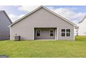 Expansive backyard featuring a gray exterior and ample space for outdoor activities at 289 Limestone Circle, Conyers, GA 30013