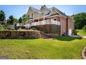 Spacious backyard featuring a large wooden deck and multi-level landscaping at 1108 Sequoia Trl, Mcdonough, GA 30252