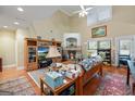 Cozy living room with hardwood floors, vaulted ceilings, fireplace, and natural light at 1154 Ridge Hollow Ln, Lawrenceville, GA 30043