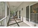 Relaxing screened porch with wood floors and ceiling fans at 160 Wills Way, Fayetteville, GA 30214