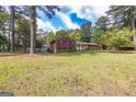 Traditional style brick home with two stories and mature trees at 8289 Lake View Ter, Riverdale, GA 30274