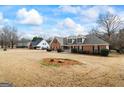 Expansive front yard and well-maintained lawn, highlighting the home's curb appeal and neighborhood setting at 115 Stewart Hollow Ln, Covington, GA 30016
