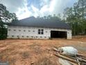 A new home under construction showing the garage and backyard space at 2012 Lakeview Pkwy, Villa Rica, GA 30180