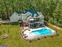 Expansive property featuring a private pool, patio, and lush landscaping at 140 Horton Creek Trl, Brooks, GA 30205