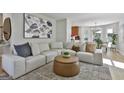Comfortable living room with a large sectional sofa, accent pillows, and stylish decor at 308 Summer Pl, Peachtree City, GA 30269