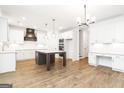 Modern kitchen with stainless steel appliances, granite countertops, and a center island at 2113 Ella Springs Dr, Covington, GA 30014