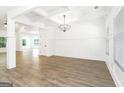 Spacious living room featuring gleaming hardwood floors, modern finishes, and abundant natural light at 2113 Ella Springs Dr, Covington, GA 30014