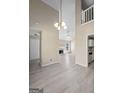 Open-concept living area with views to the kitchen and fireplace creating an inviting atmosphere at 5882 Trent Walk Dr, Lithonia, GA 30038