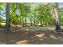 Single-Gathering home sits back from the road and features mature landscaping and long front porch at 423 Bear Creek Trail, Hampton, GA 30228