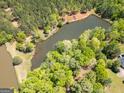 Scenic aerial shot showcasing a peaceful pond surrounded by lush greenery at 637 Lakeview Dr, Newborn, GA 30056