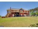 Large two-story brick house with spacious deck and walkout basement at 637 Lakeview Dr, Newborn, GA 30056