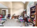 Bright living room with beige walls, shuttered windows, and unique decorations at 122 Ardenlee Dr, Peachtree City, GA 30269