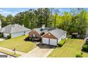 A well-maintained single-Gathering home with a two-car garage and a lush lawn at 11970 Fairway Overlook, Fayetteville, GA 30215