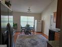 Eat-in kitchen featuring hardwood floors and a round dining table at 35 Charleston Ln, Covington, GA 30016