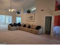 Open living room with a large sectional sofa and neutral decor at 35 Charleston Ln, Covington, GA 30016