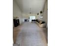 Spacious living room with a fireplace and large sectional sofa at 35 Charleston Ln, Covington, GA 30016