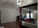 Bedroom featuring hardwood floors, natural light, and plenty of space, perfect for relaxation and comfort at 1253 Heartwood Ave, Mcdonough, GA 30253