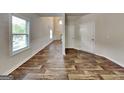 Inviting entrance hallway with durable flooring, neutral walls, and high ceilings that brings a sense of spaciousness at 1162 Ida Woods Ln # 23, Lawrenceville, GA 30045