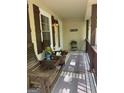 Inviting front porch featuring wooden rocking chairs and decor providing a cozy entry at 15 Perthshire Dr, Peachtree City, GA 30269