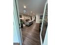 Spacious living room with hardwood floors, recessed lighting, and modern furnishings at 15 Perthshire Dr, Peachtree City, GA 30269