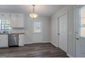 Bright kitchen area featuring stainless steel appliances, butcher block countertops and contemporary lighting fixture at 842 Brighton Dr, Lawrenceville, GA 30043
