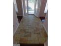 Inviting foyer with decorative tile flooring, and view of the front door at 7541 Coddington Ct, Riverdale, GA 30274