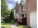 Brick home with well-manicured lawn, sidewalk and mature trees in a quiet residential neighborhood at 514 Augusta Dr, Canton, GA 30115