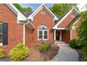 Close up of the front entrance highlighting the beautiful brickwork and manicured landscaping at 1270 Tribble Walk Ct, Lawrenceville, GA 30045