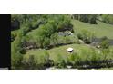 Expansive property featuring a home with a pool, barn, and sprawling green pastures at 288 Trickum Creek Rd, Tyrone, GA 30290