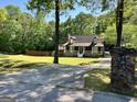 Exterior view of home with an extensive yard and a driveway leading up to the home at 96 Daniel Ct, Mcdonough, GA 30253