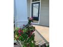 Inviting front porch with flower accents providing a warm welcome to this charming home at 2681 Mariner Way, Villa Rica, GA 30180