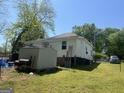The backyard features a storage shed and fencing for privacy, with a grill ready for outdoor cooking at 3143 S West St, Covington, GA 30014
