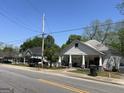 Street view of the property showing neighboring homes, sidewalks, and a clear sky above at 3143 S West St, Covington, GA 30014