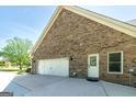Brick exterior with a spacious two-car garage and ample parking at 330 Noah Pl, Mcdonough, GA 30252