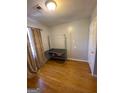 Cozy bedroom featuring hardwood floors, natural light, and neutral paint at 1025 Lynwood Pl, Forest Park, GA 30297