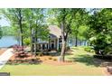 Two-story brick home with mature trees and easy access to lake at 513 Viridian Vw, Peachtree City, GA 30269