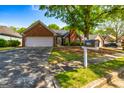 Beautiful single-Gathering home with a brick exterior, mailbox, and a two-car garage at 140 Carriage Chase, Fayetteville, GA 30214