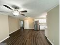 Open-concept living space featuring modern flooring, stainless steel appliances, and neutral paint at 1962 Marvin Sw Ln, Atlanta, GA 30311